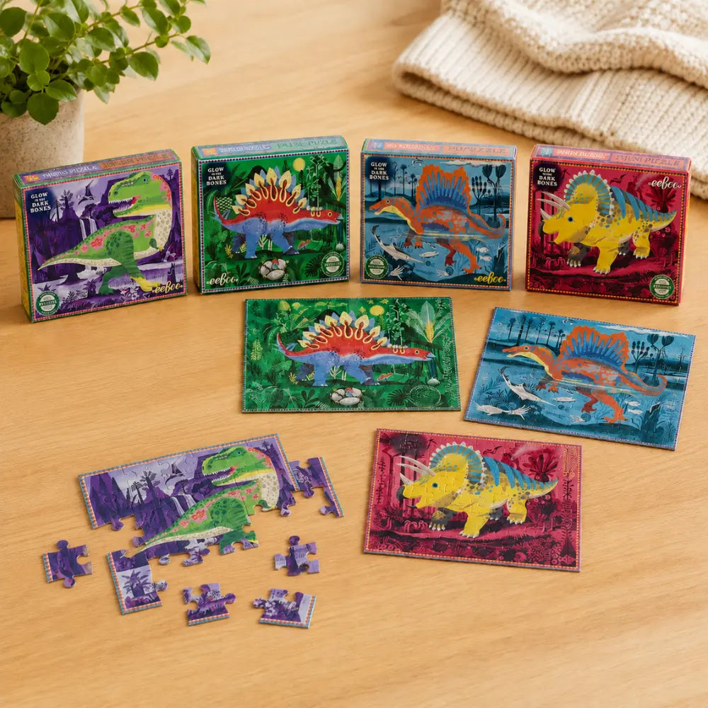 Children playing with eeBoo dinosaur 36 piece mini puzzles from a set of four