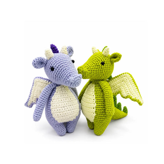 Finished green and lilac crocheted dragons from a DIY dragon crochet kit