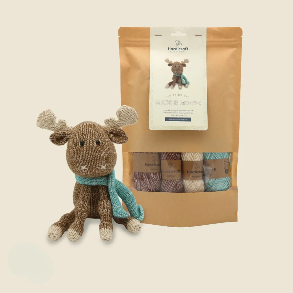 Hardicraft Maddie Moose DIY knitting kit shown with the completed knitted moose