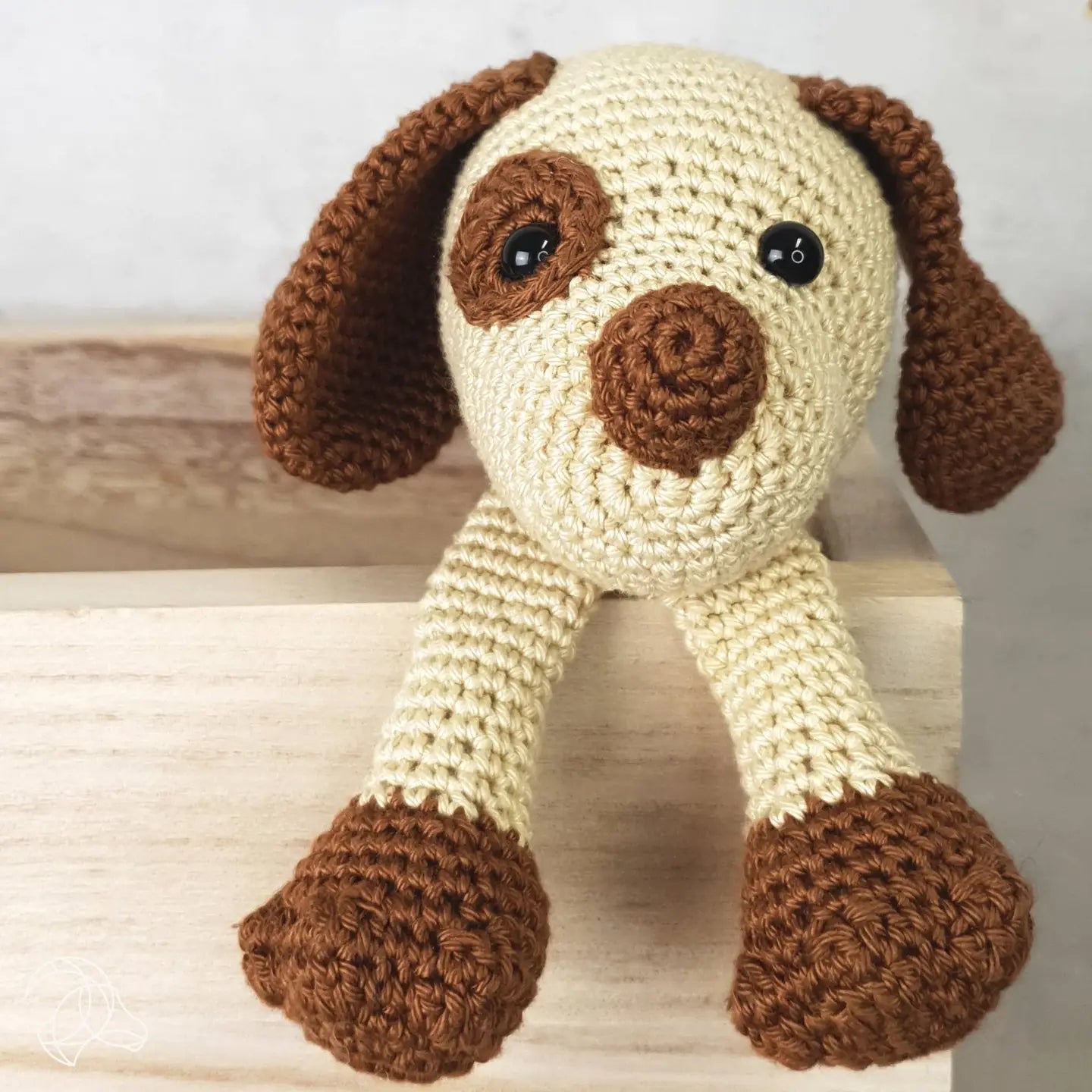 Finished crocheted puppy stuffed animal from a DIY crochet kit
