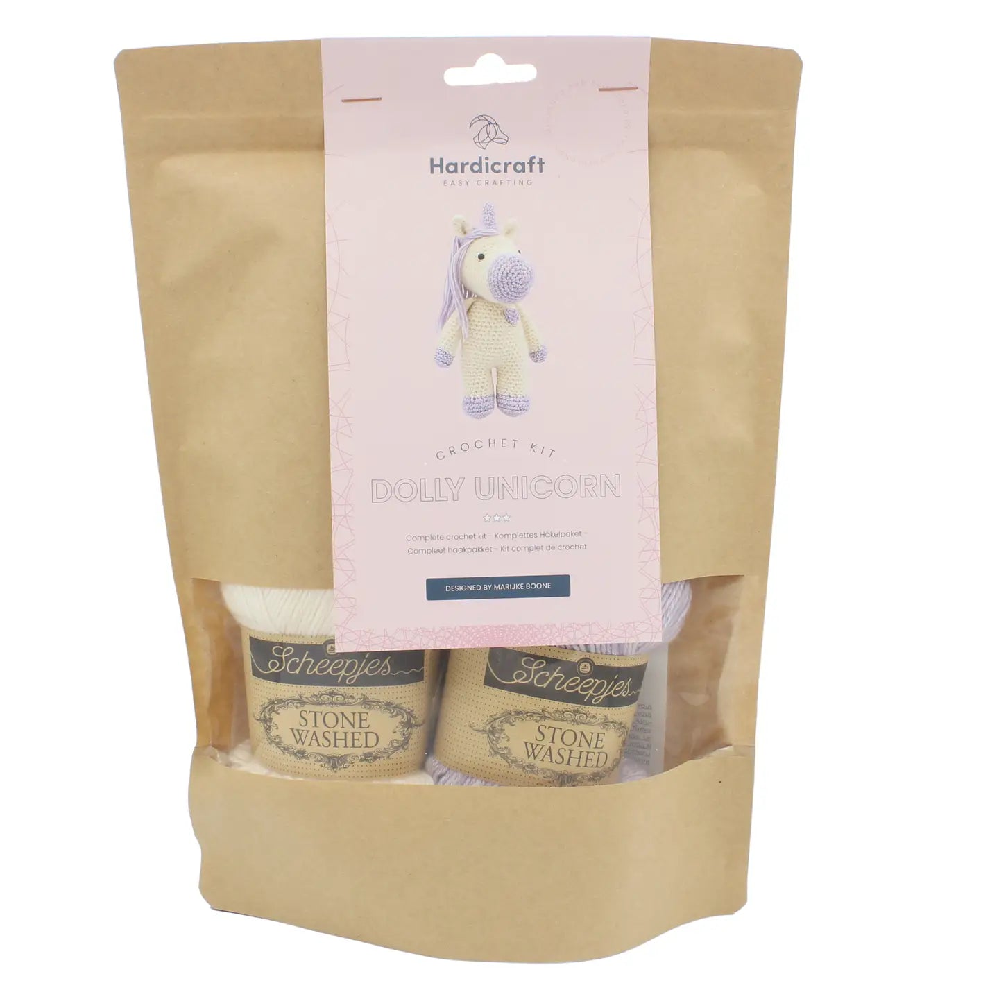 DIY unicorn crochet kit package with Scheepjes yarn, stuffing, safety eyes, and pattern