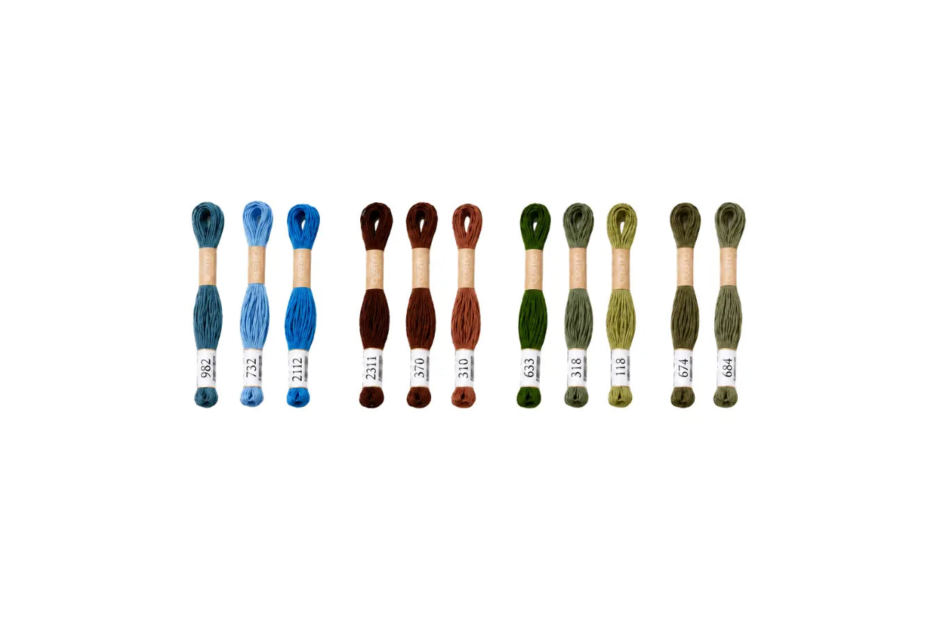 Set of embroidery threads in various colors for doll eyes, embroidery, or cross stitch on a white background