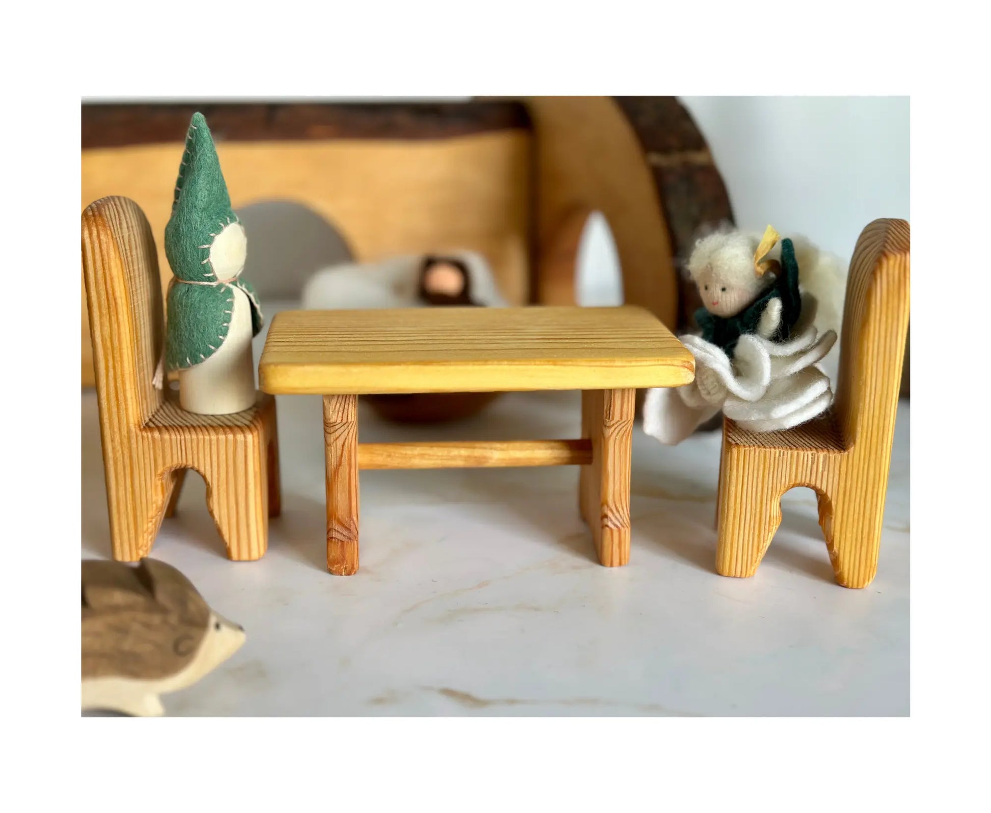 Wooden dollhouse table and chairs in a miniature home scene for imaginative storytelling