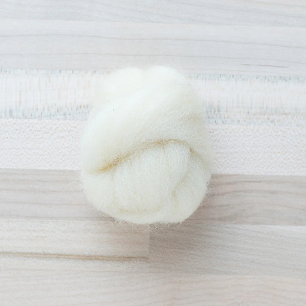 Dove White Wool Roving Felter's Flowing on tabletop