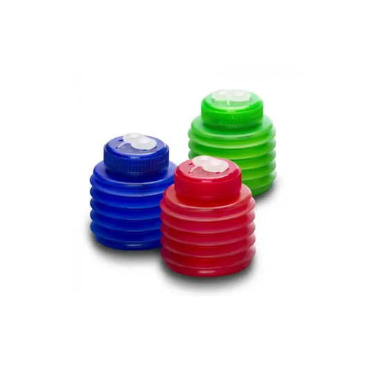 Three colorful plastic bottles with caps on a white background