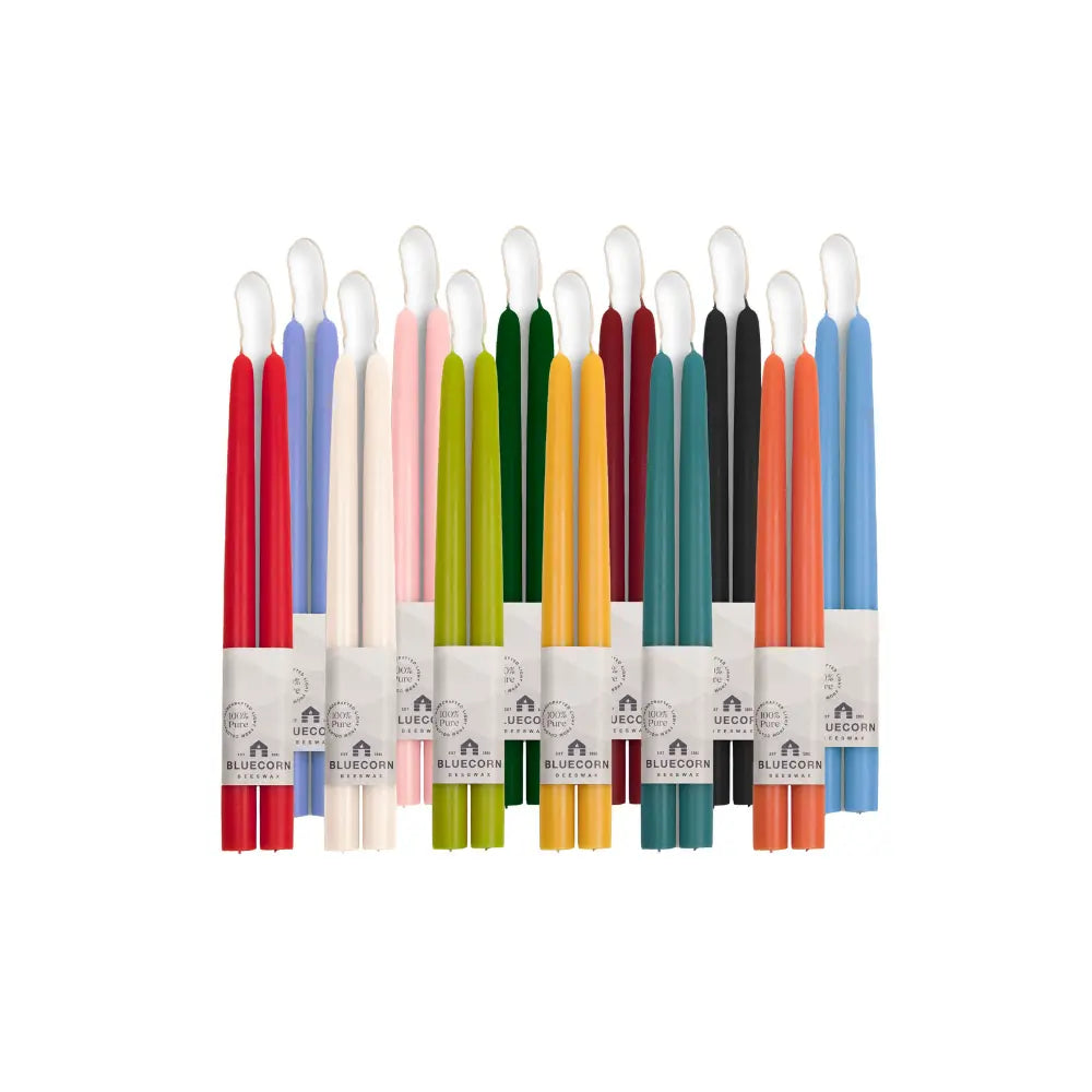 Set of colorful dyed beeswax taper candles with Bluecorn branding