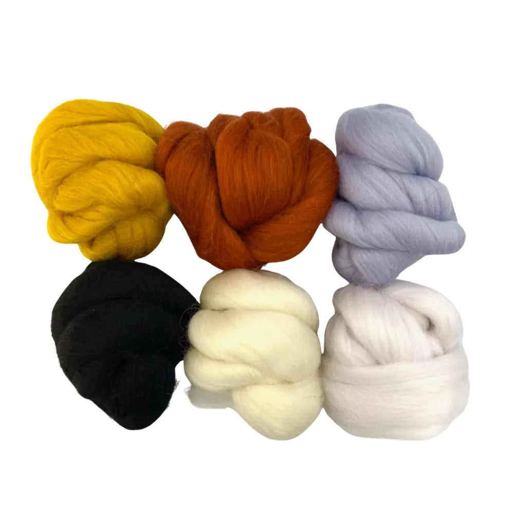 Set of six Corriedale wool spinning fiber on a white background