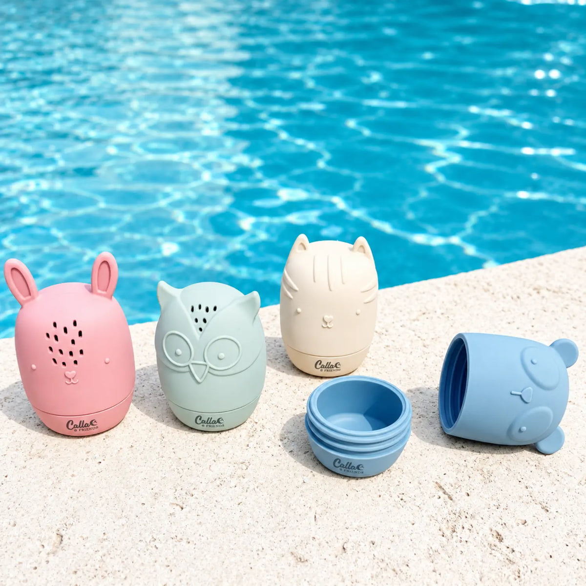 Silicone animal bath toys by the pool with blue bear toy opened into two pieces for cleaning
