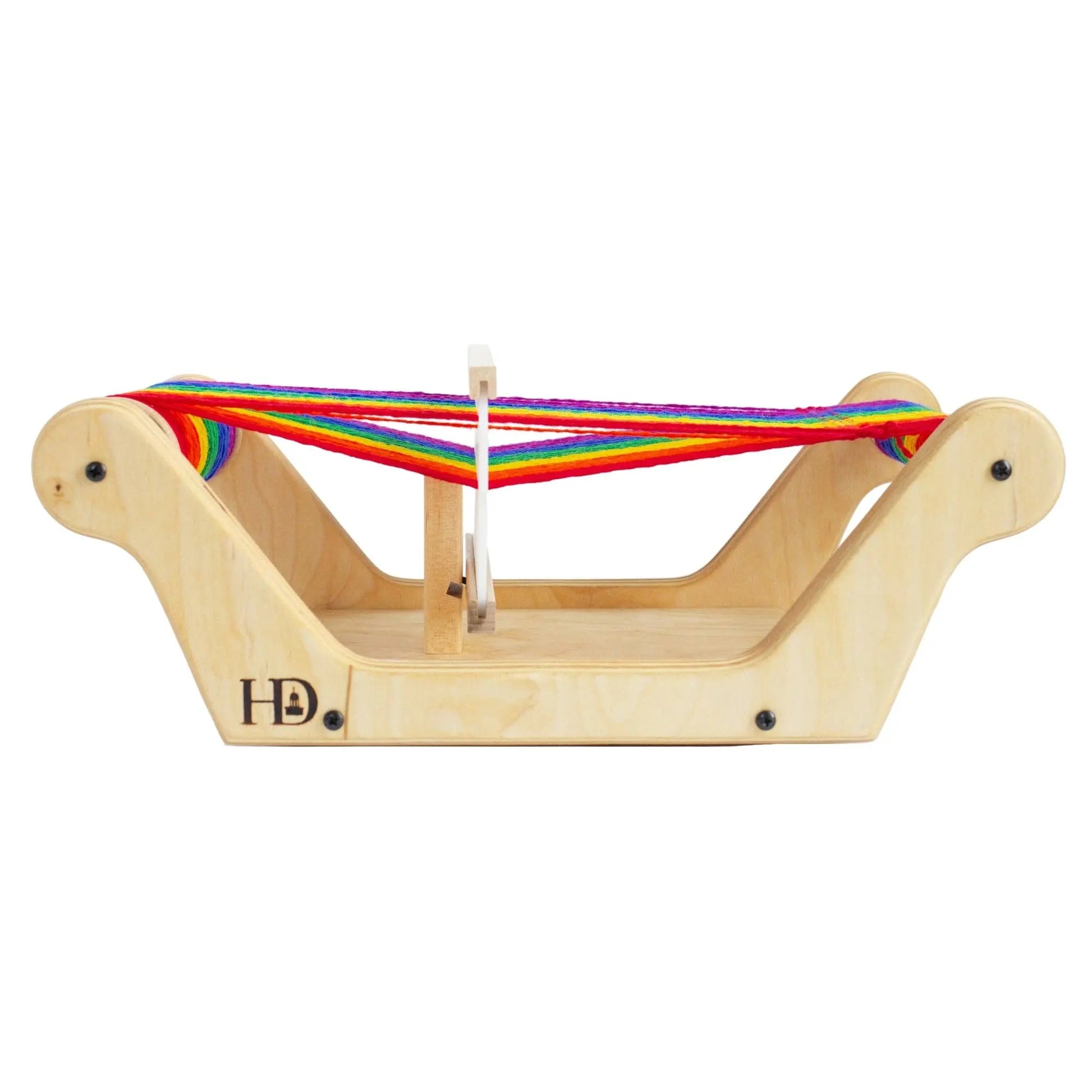 Side view of Easy Weaver table loom threaded with rainbow wool warp