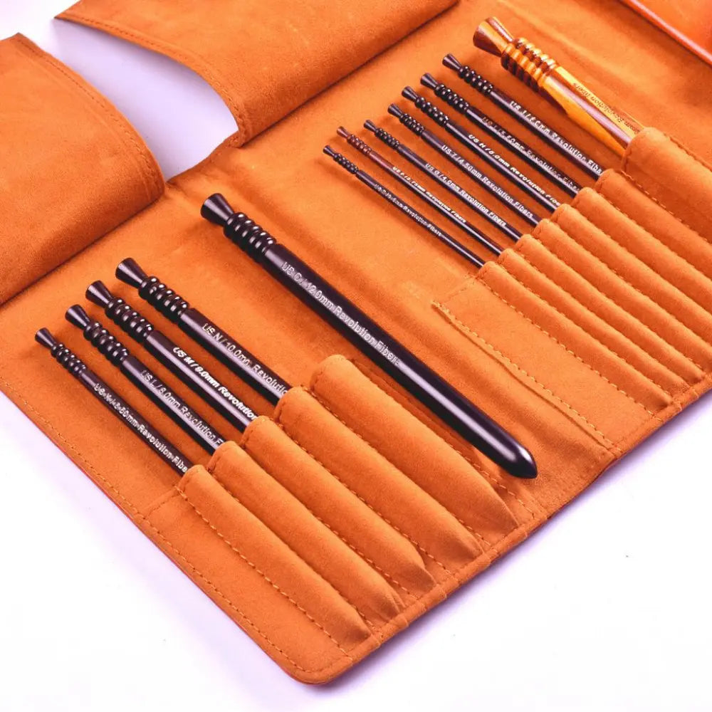 Set of black tools in an orange case on a white background