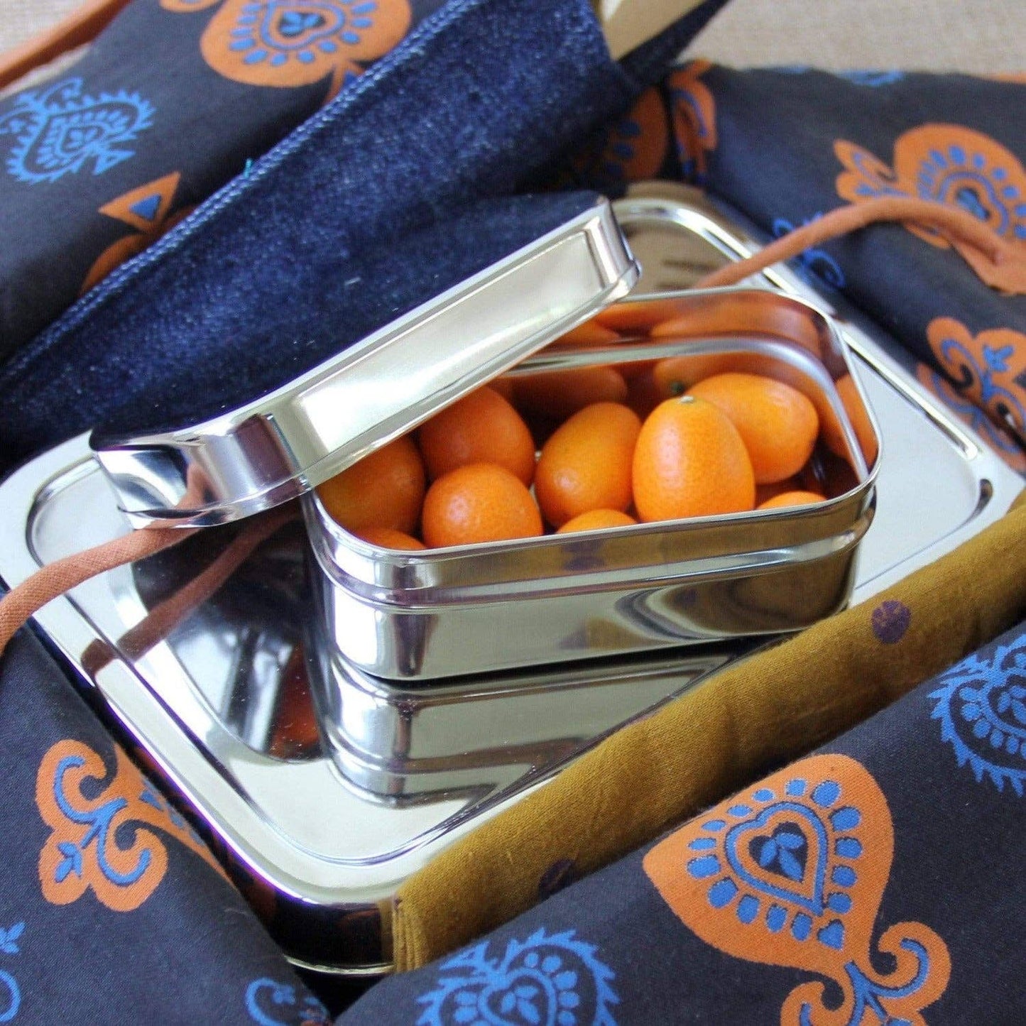 ECOlunchbox ECOlunchpod packed with small tomatoes inside a lunch bag