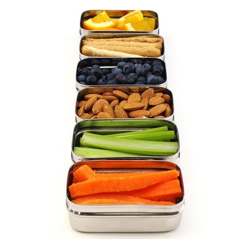 ECOlunchbox ECOlunchpod containers filled with carrots, celery, nuts, blueberries, crackers, and orange slices