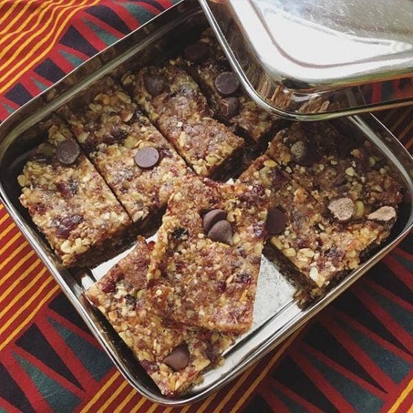ECOlunchbox Solo Cube stainless steel container holding homemade snack bars
