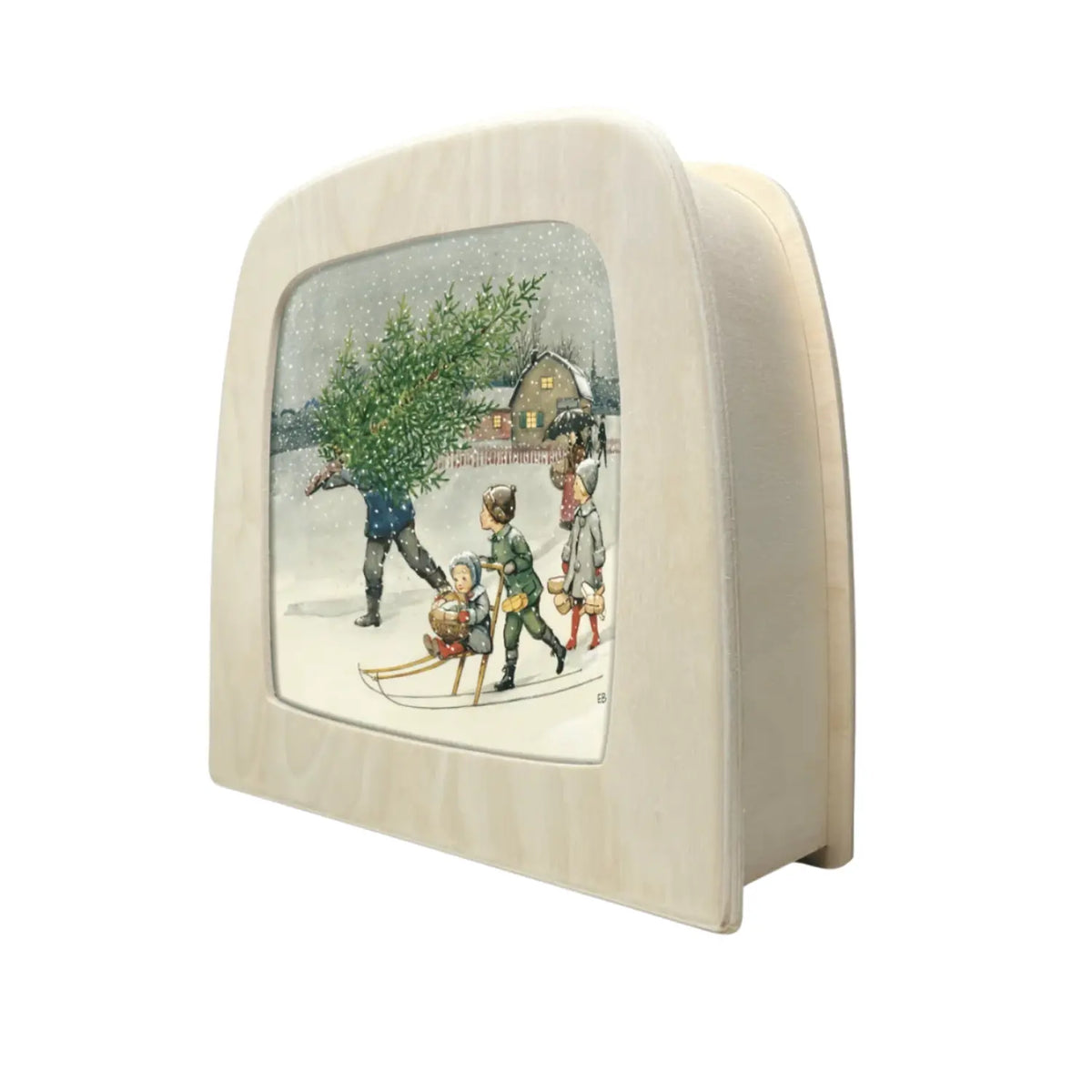 A Toverlux lamp plate scene of a family and a Christmas tree in the snow from Elsa Beskow's Around the Year Book