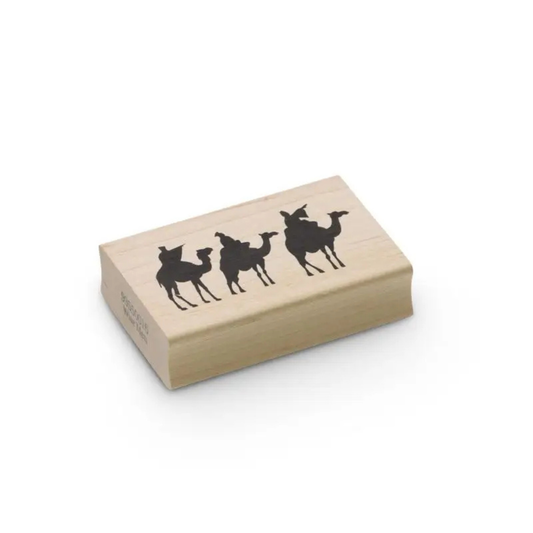 Three Wise Men on their camels rubber and wood stamp on a white background