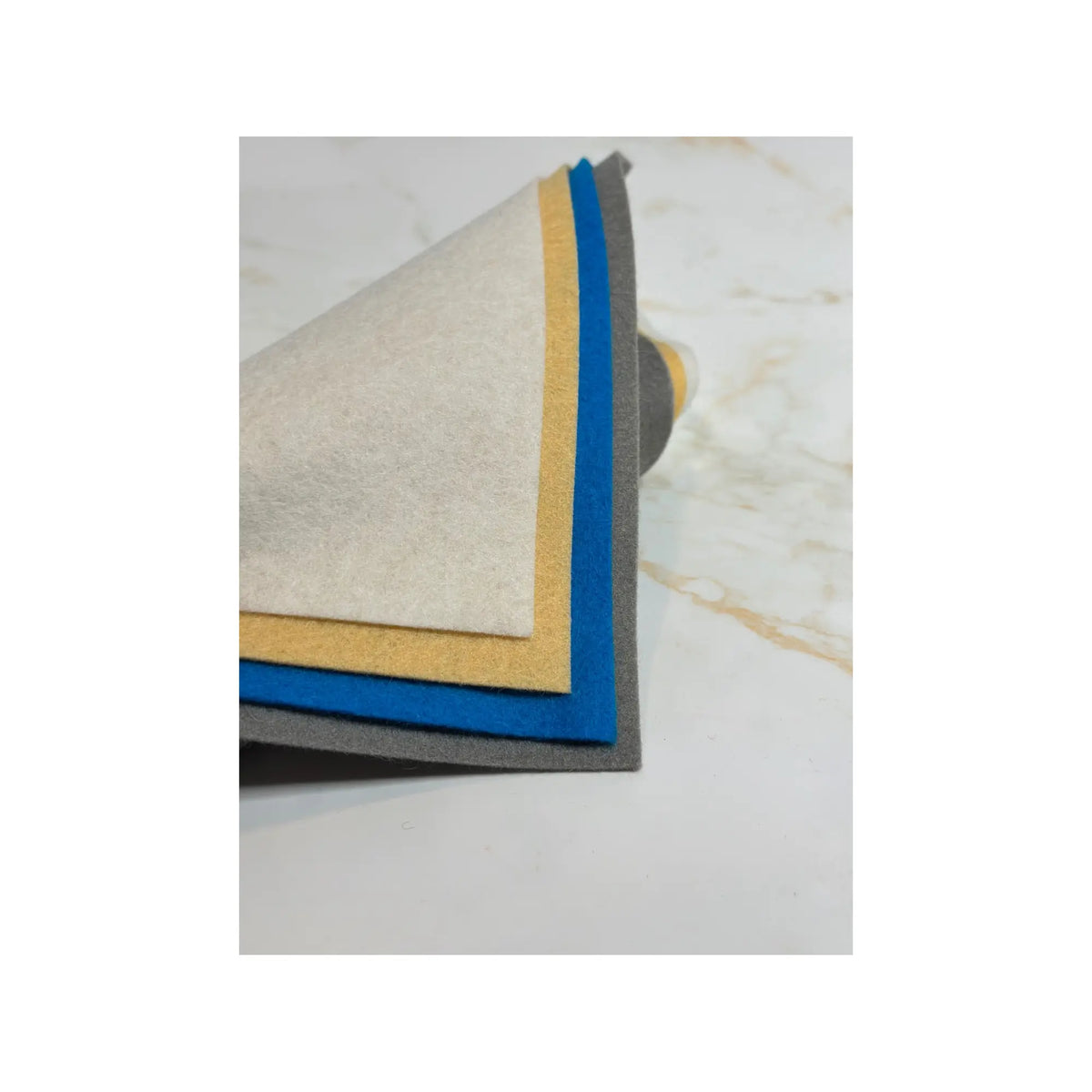 100% Wool Felt sheets layered to show different colors in white, apricot turquoise, and grey