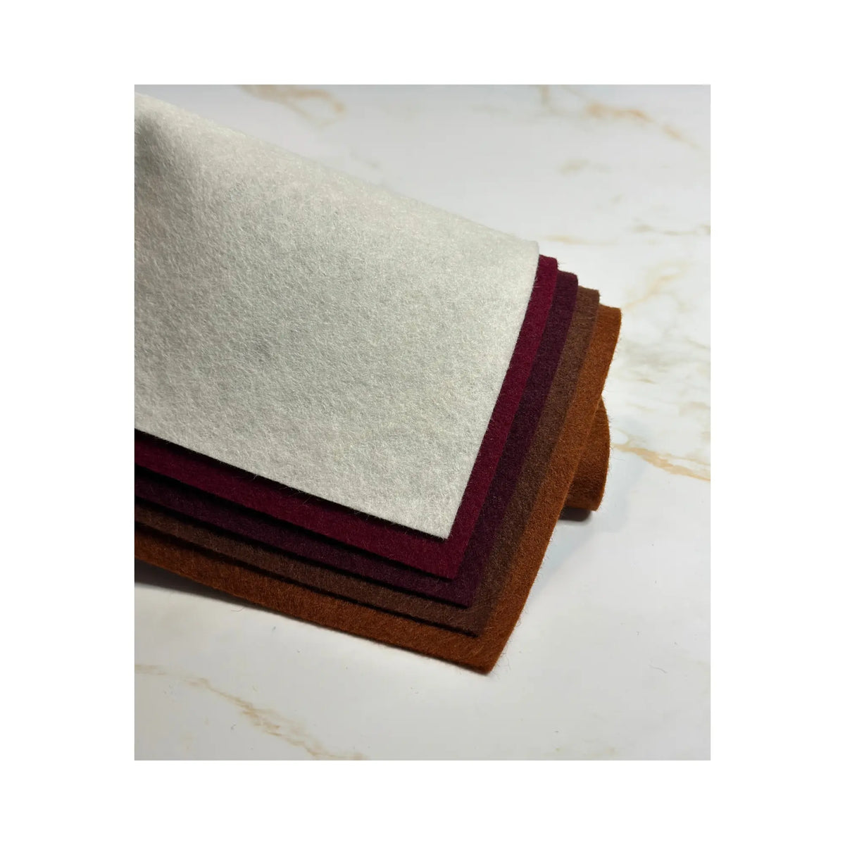 100% Wool Felt sheets layered to show colors in white, carmine red, bordeaux red, dark brown, and red brown