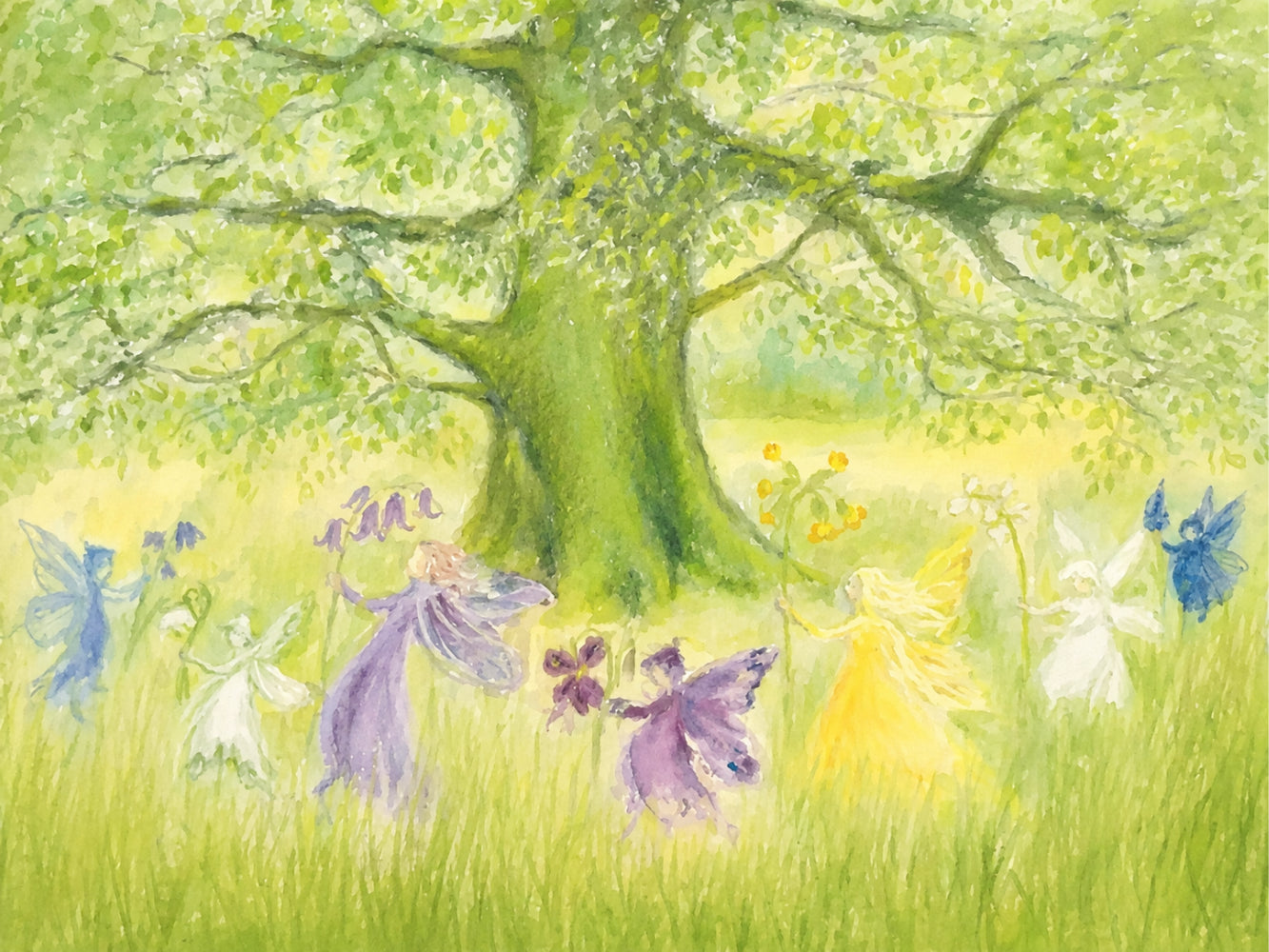Illustration of fairies under a tree with colorful wings in a grassy field.