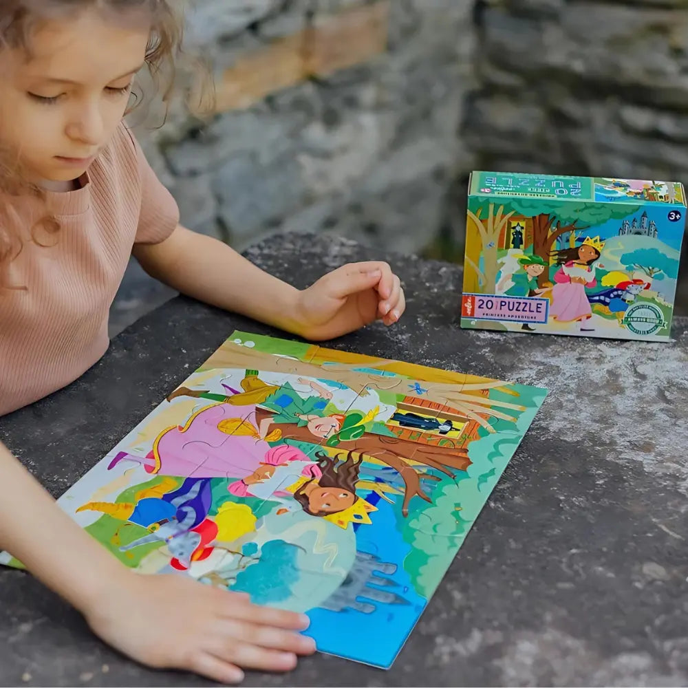 Child playing with a princess-themed puzzle outdoors