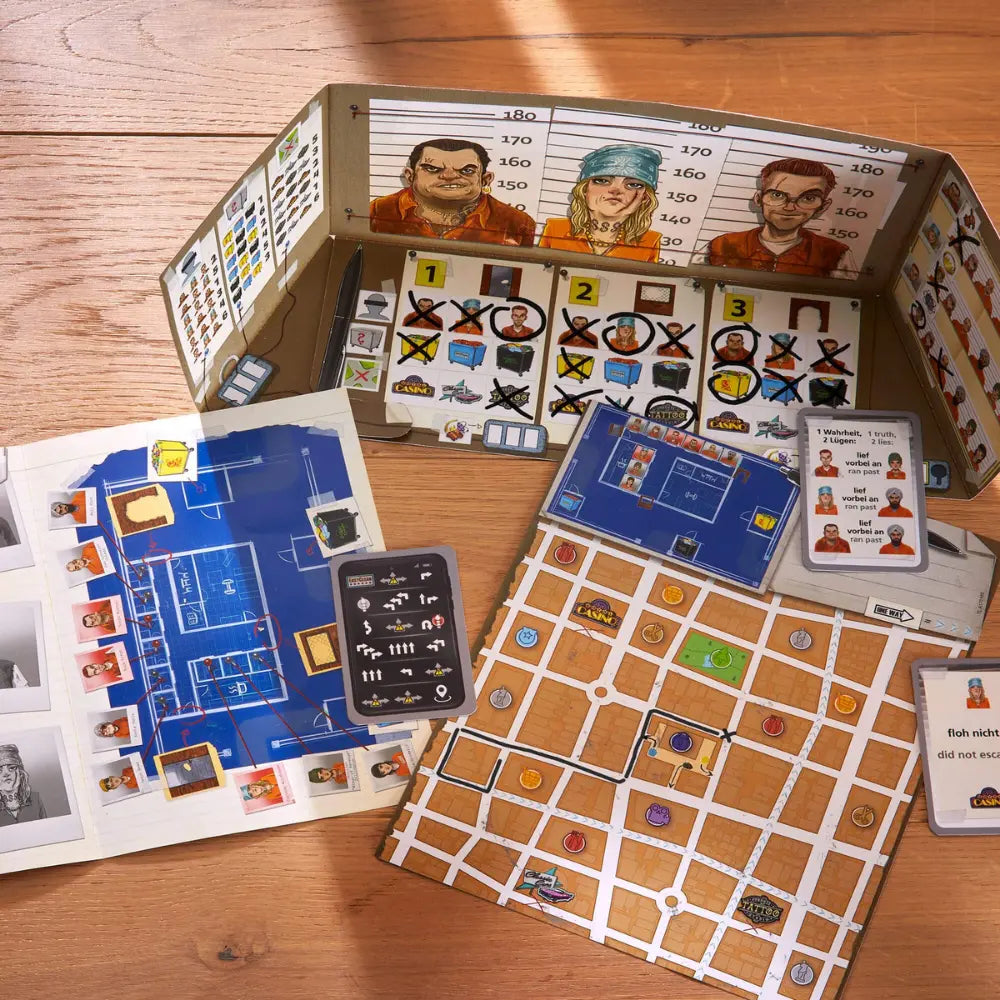 Board game components including cards, board, and character sheets on a wooden surface