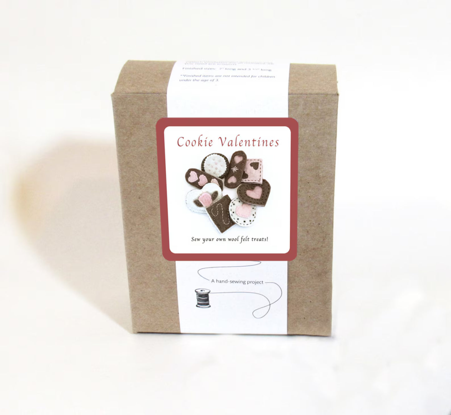 Box of 'Cookie Valentines' craft kit with heart-themed illustrations on a white background