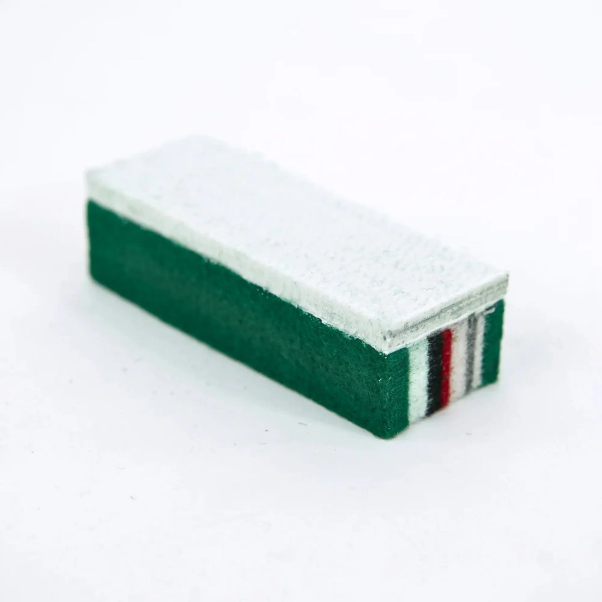 Rectangular eraser with green and red stripes on a white background