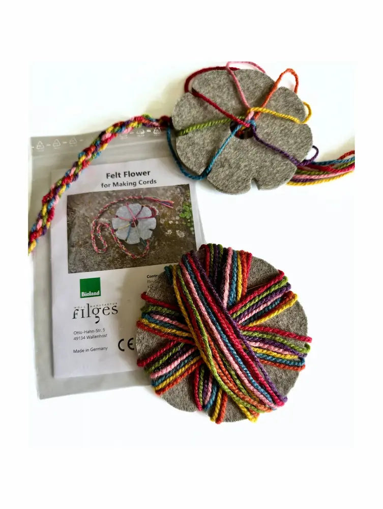 Filges Felt Flower Braiding Kit for Waldorf Handwork with rainbow yarn on white
