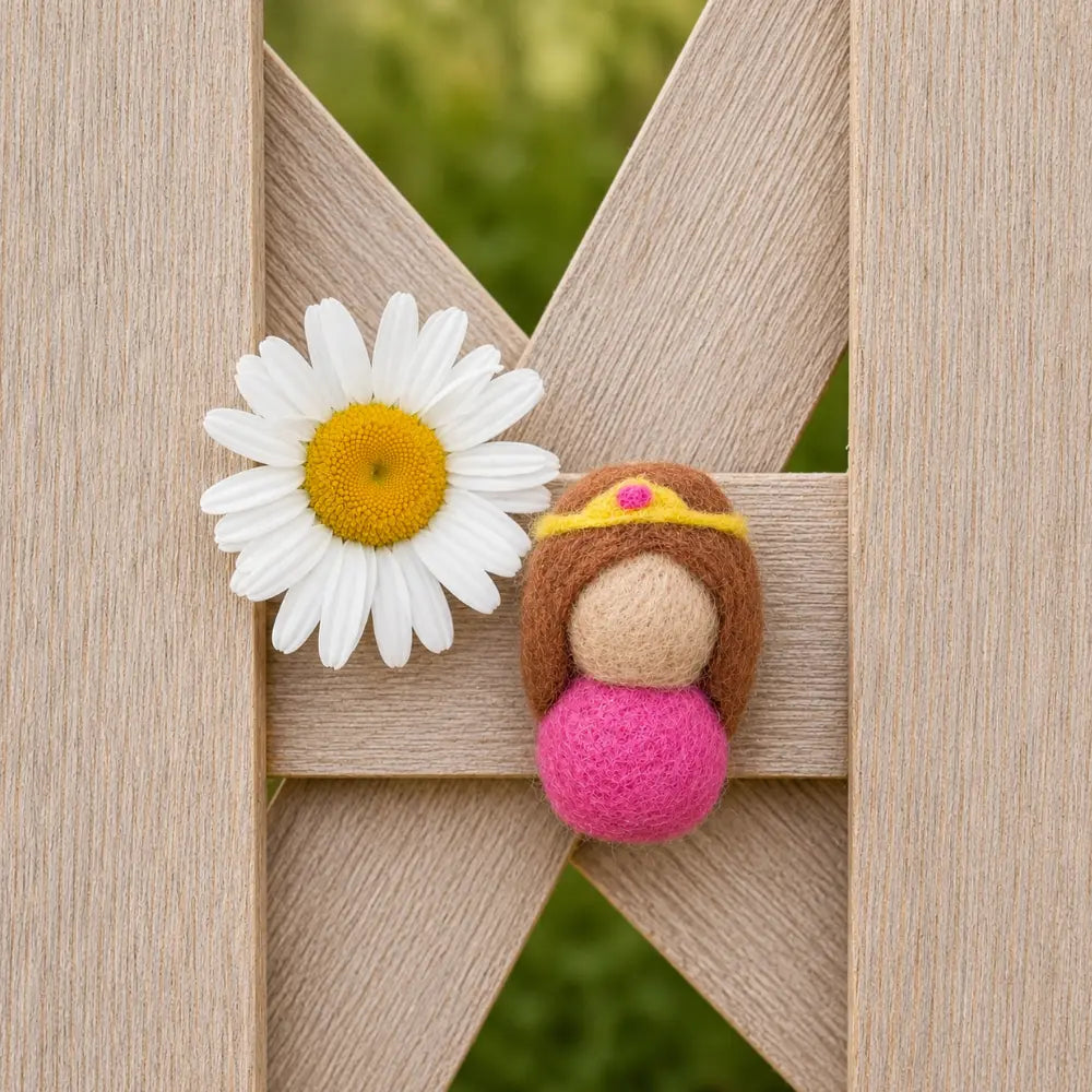 Hand-felted wool princess storytelling toy with daisy for fairy tale play and small world imaginative scenes.