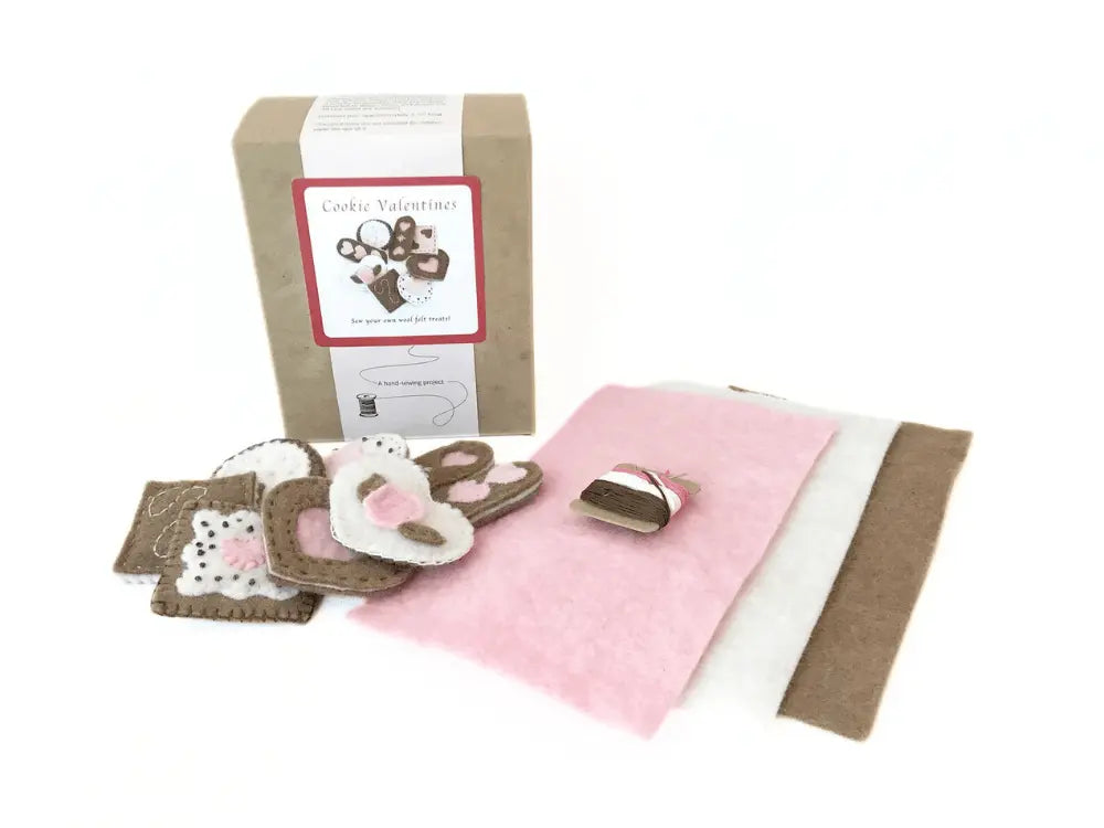 Baby care product set with pink blanket, pacifier, and other items on a white background