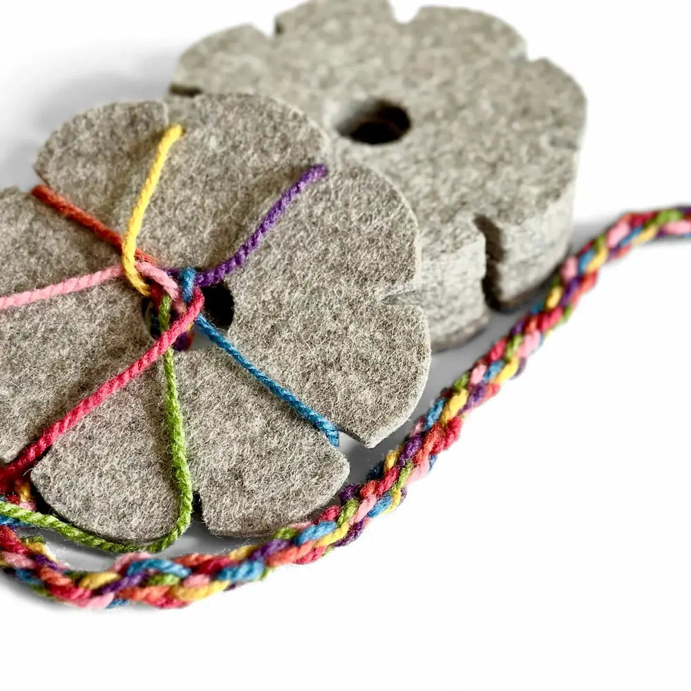 Wool felt Filges braiding flower for making kumihimo cords with rainbow cords on white