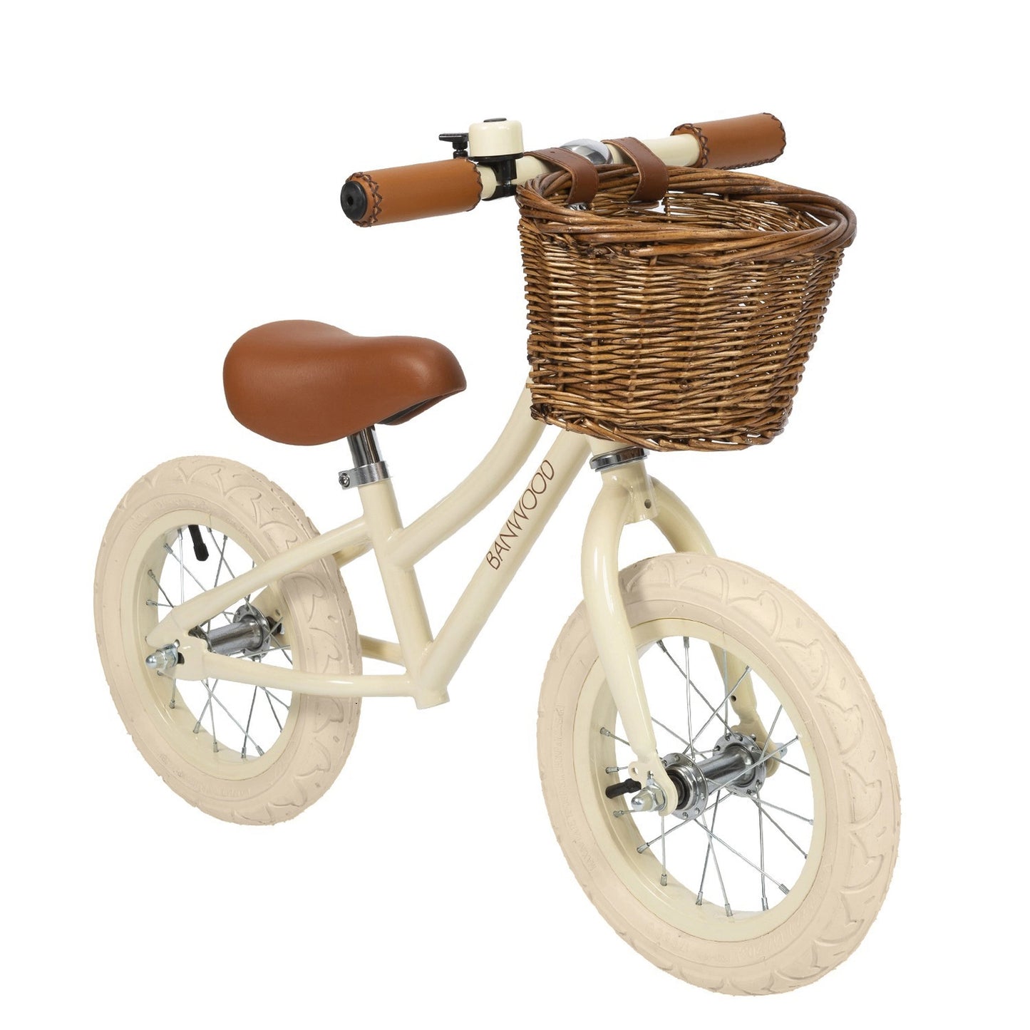 Beige balance bike with a brown basket and seat on a white background