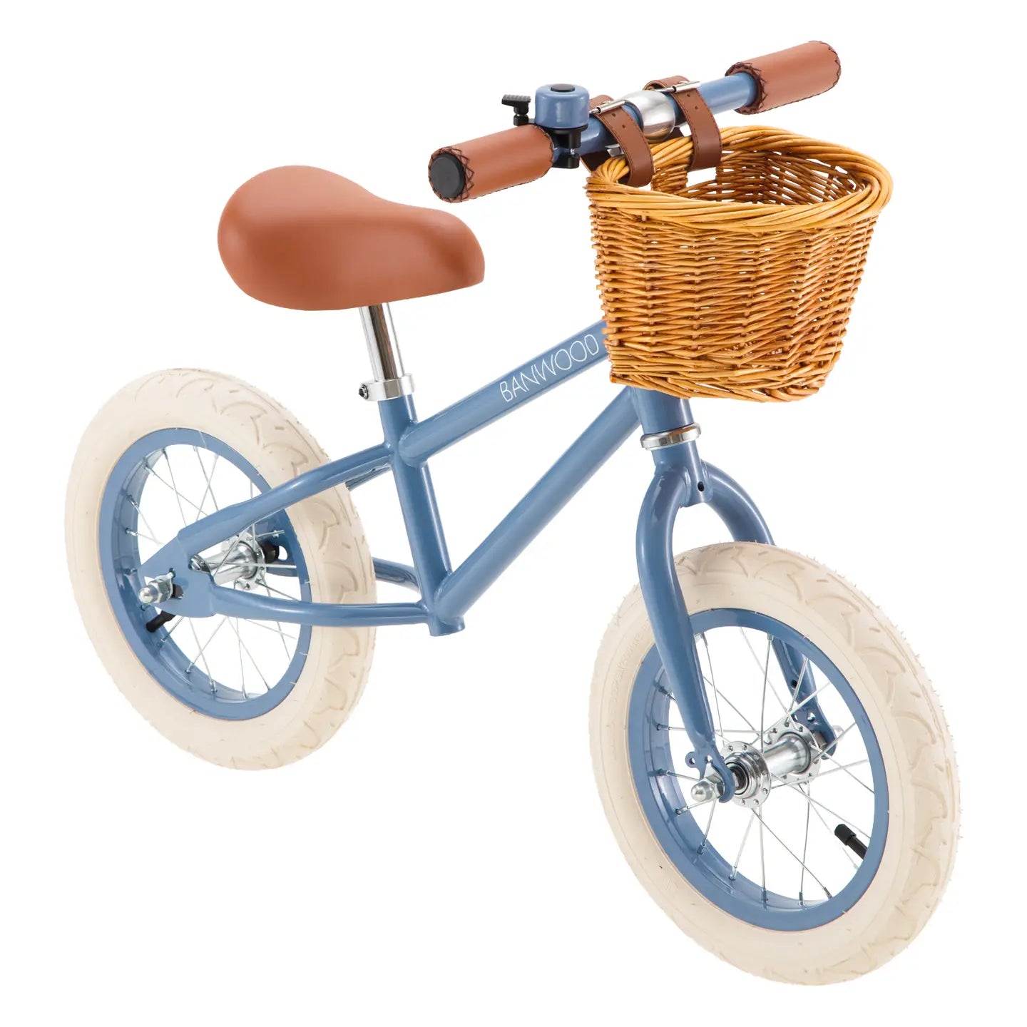 Blue balance bike with a wicker basket on a white background
