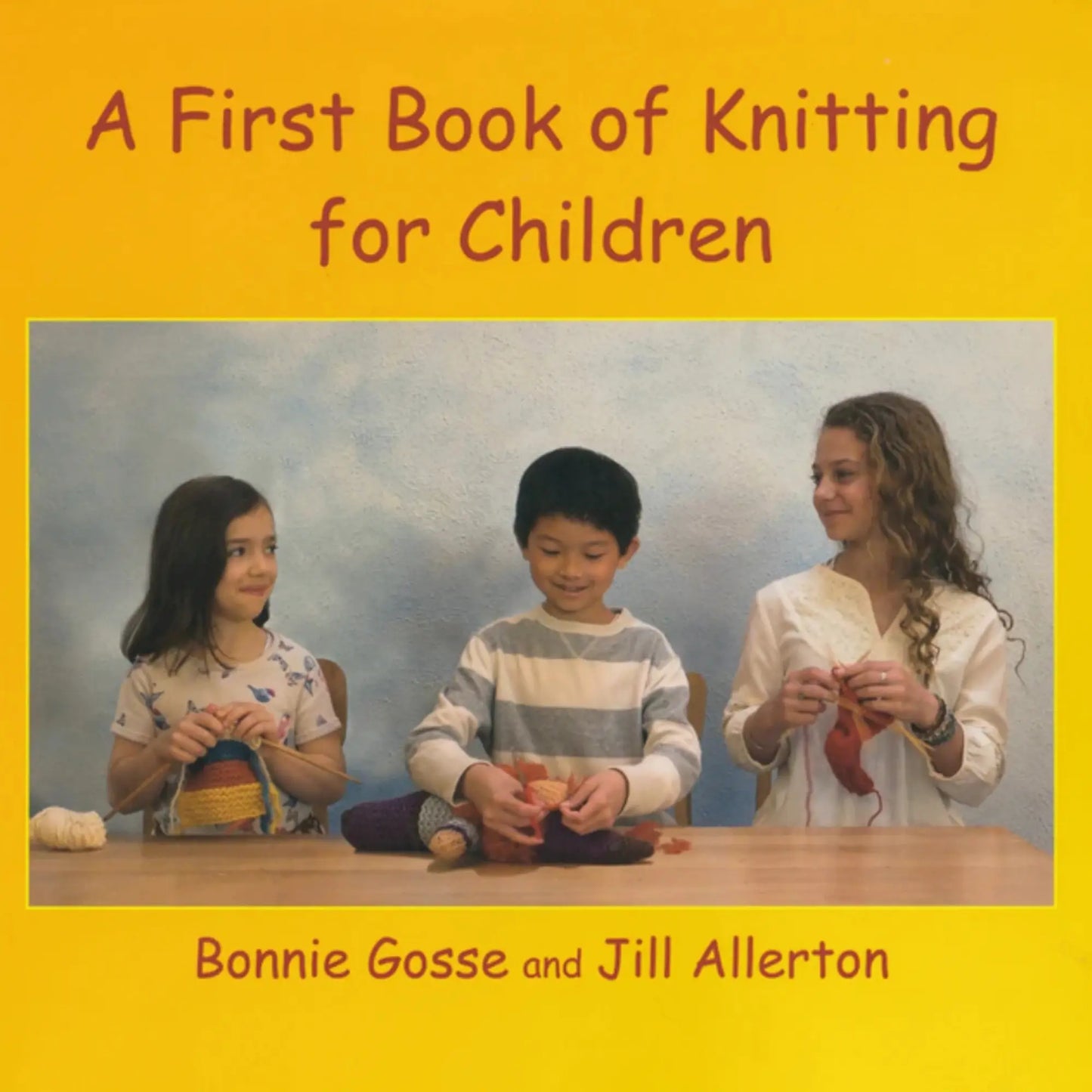 Book cover of 'A First Book of Knitting for Children' with three children knitting.