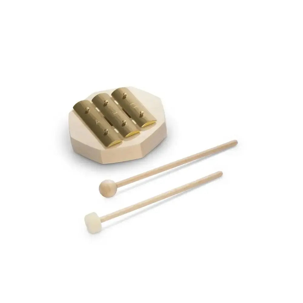 Small brass glockenspiel instrument for children with two mallets on a white background