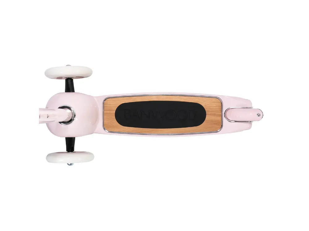 Pink scooter with wooden deck on a white background