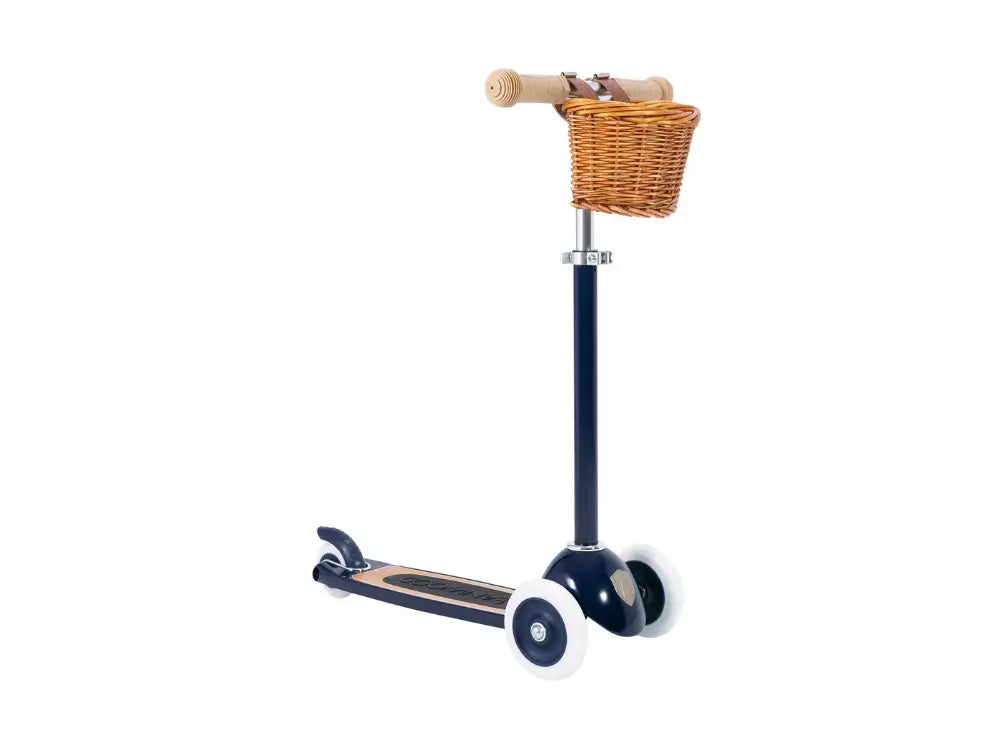 Children's scooter with a wicker basket on a white background