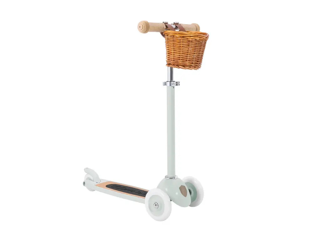 Children's pale mint scooter with a wicker basket on a white background