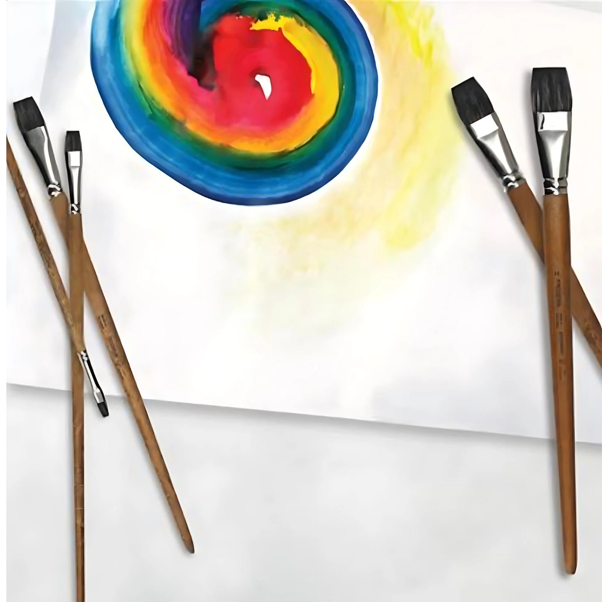 Flat watercolor brushes used for wet-on-wet painting with blended color on paper
