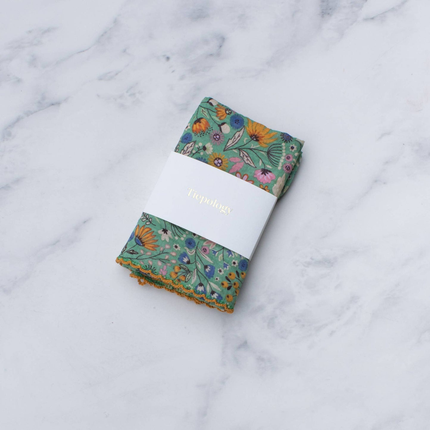 Folded Flower Fields cotton blend square scarf by Tiepology in mint green floral print