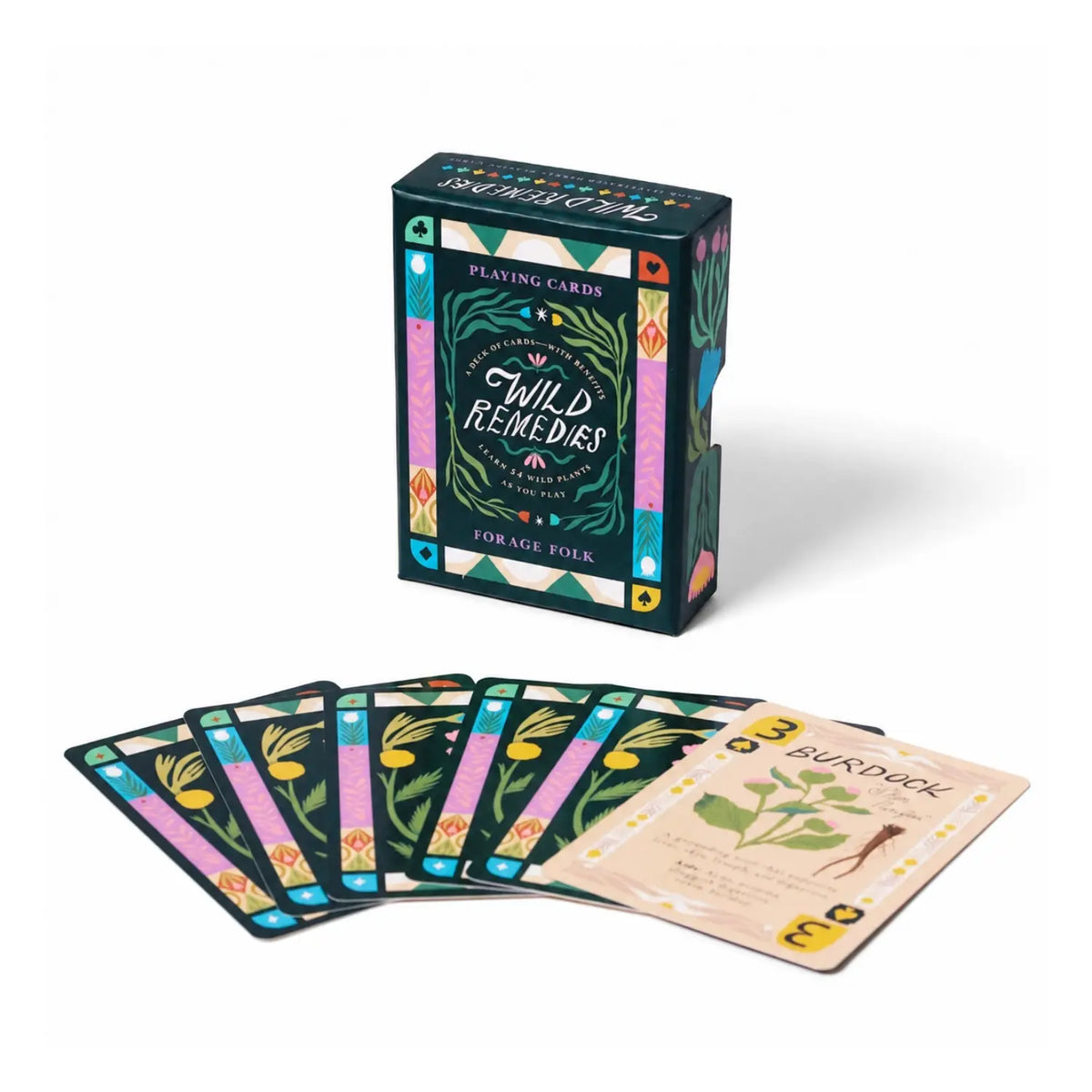 Standing Wild Remedies box behind fanned botanical card backs and a face-up Burdock card.