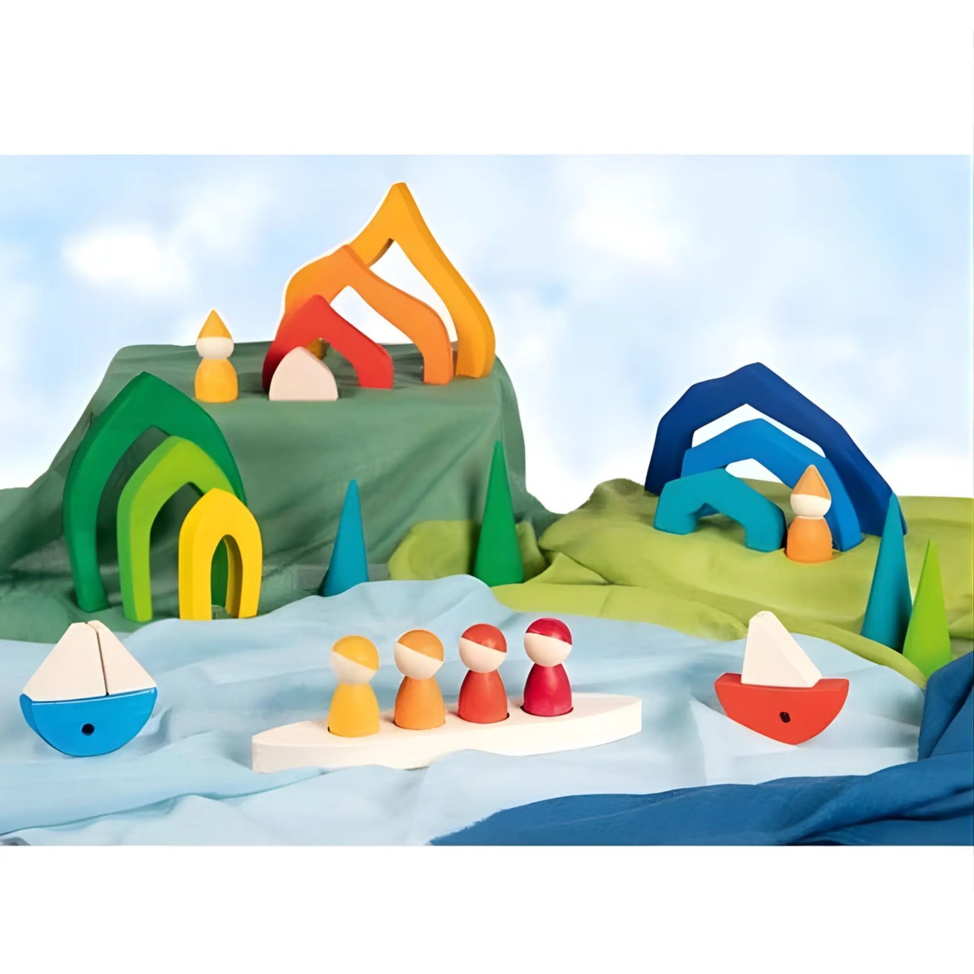 Small world play scene with wooden peg dolls, wooden boats, and wooden arches on playcloths