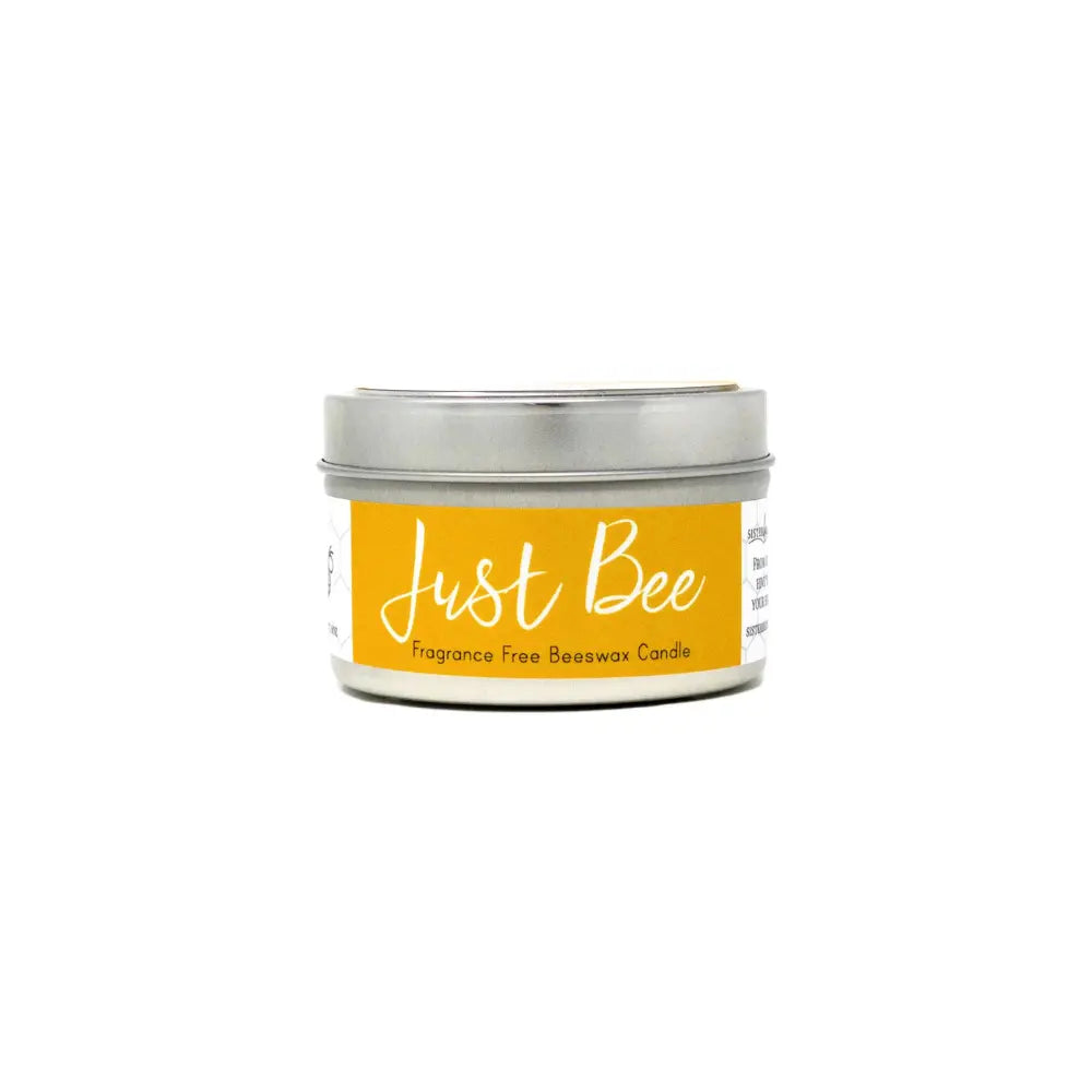 Candle tin labeled 'Just Bee' on a white background