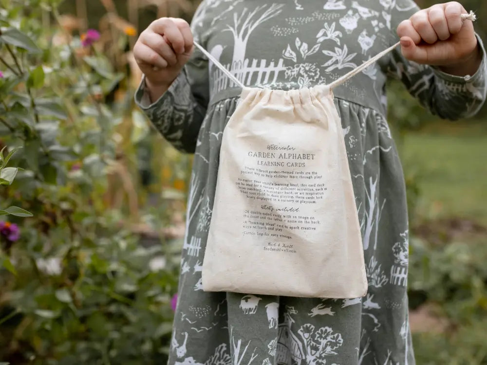 Garden alphabet cards stored in hand-stamped cotton drawstring bag