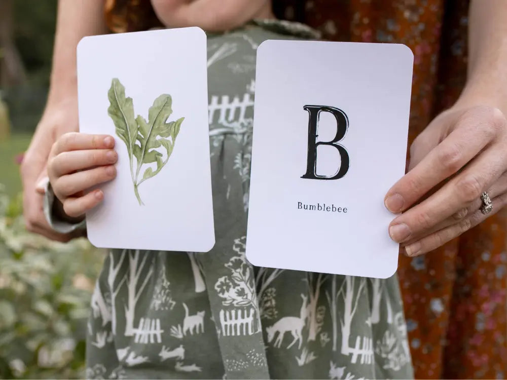 Garden alphabet card showing letter B with bumblebee illustration