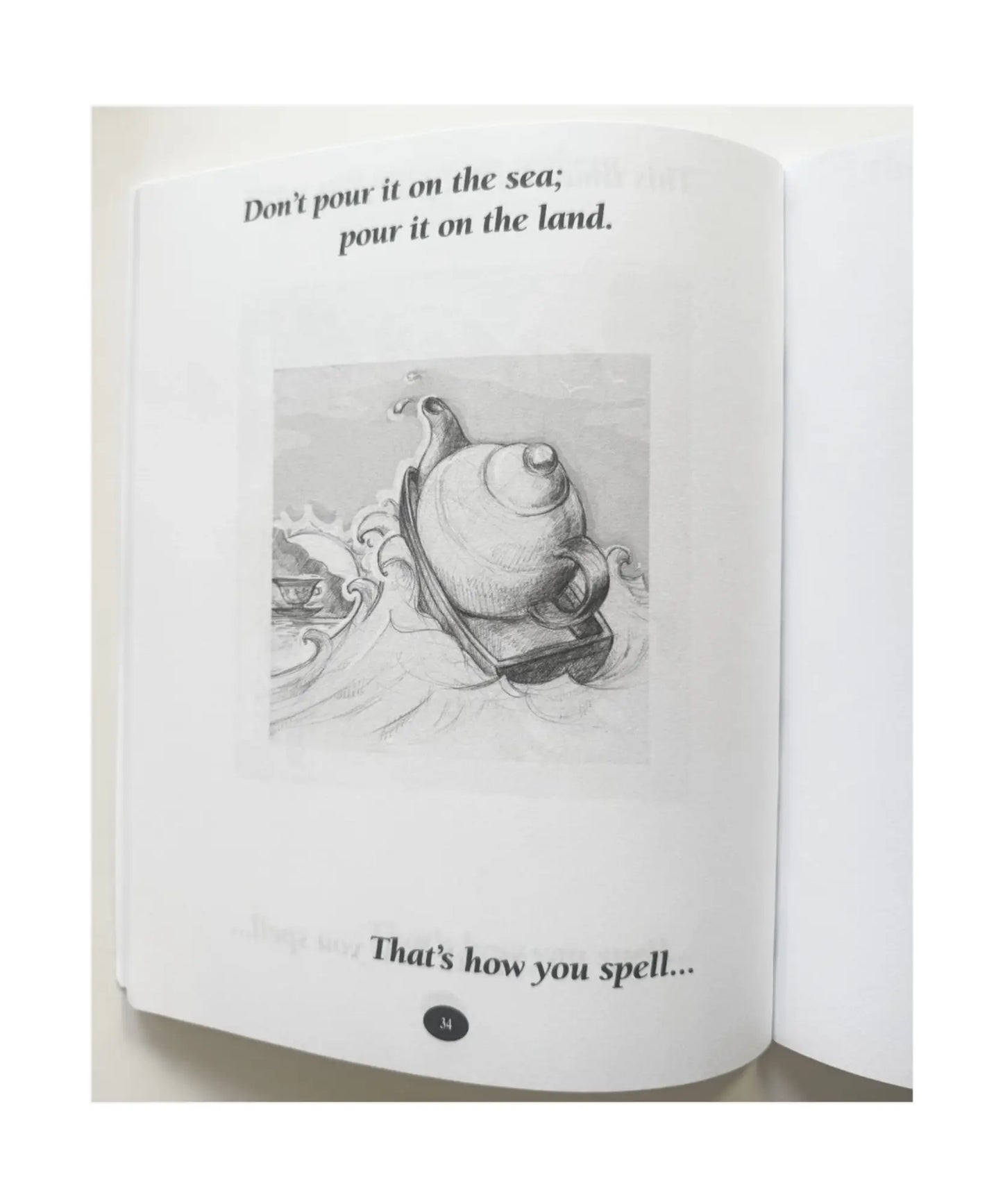Open geography riddle book with a black and white illustration of a snail and text on a white background