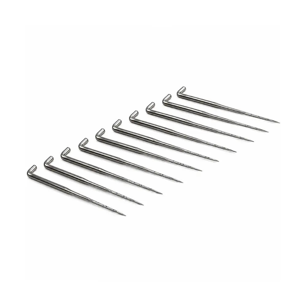 Set of metal felting needles arranged in a row on a white background
