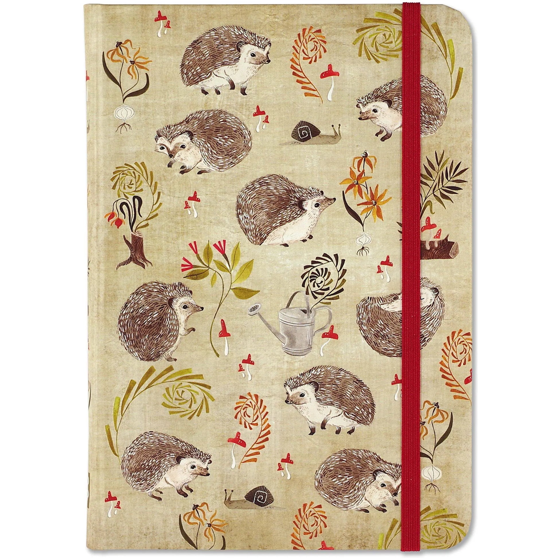 Notebook with hedgehog and floral pattern on beige background