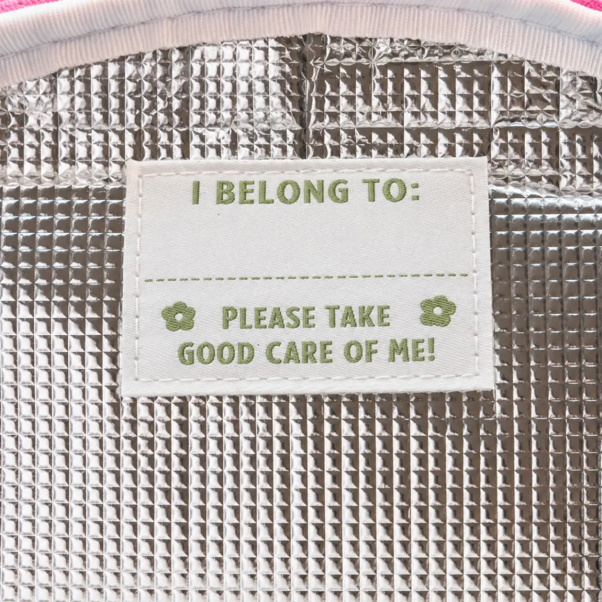 Silver insulated lunch bag interior with an I Belong To name label