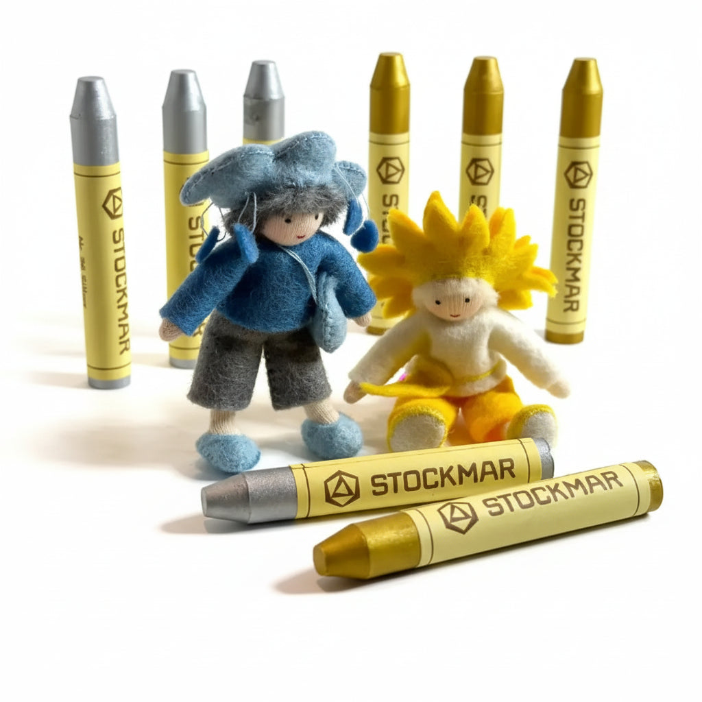 Toy figures with Stockmar crayon-like bodies on a light background