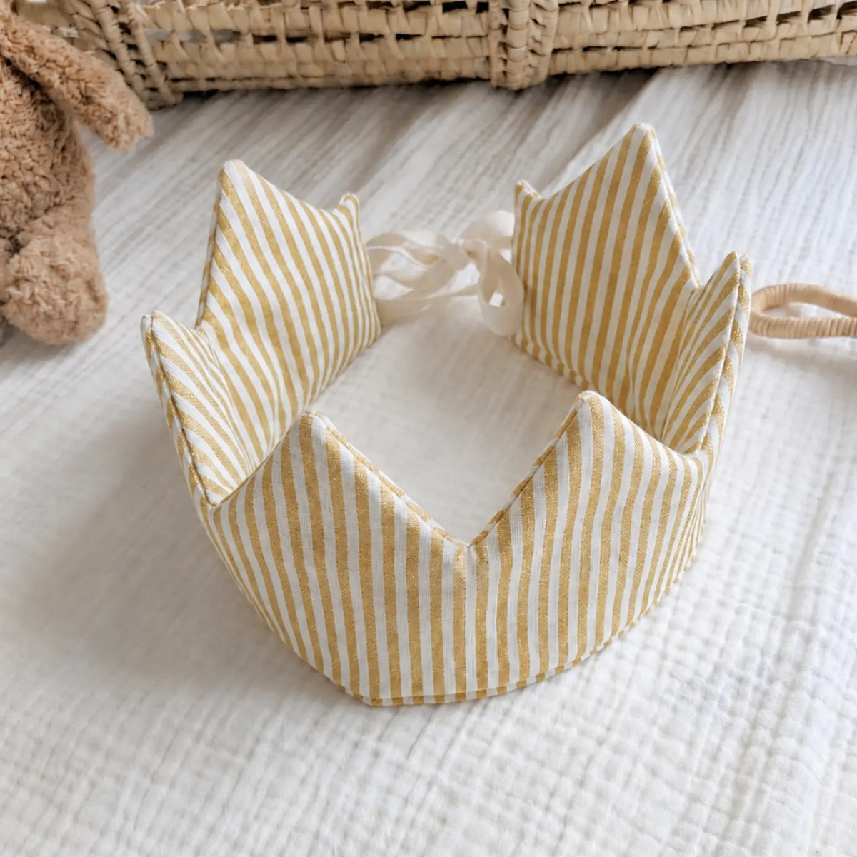 Golden mustard striped linen children's crown shown open with adjustable ties